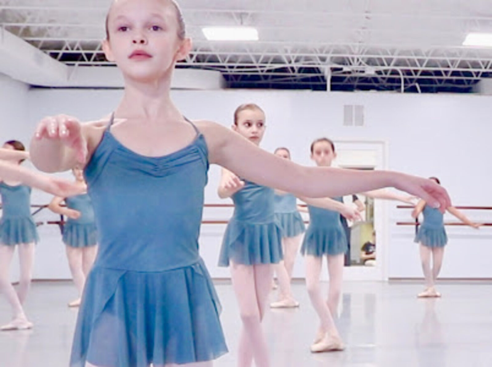 Young Ballet 2 students practicing at the barre at Brevard Ballet Academy