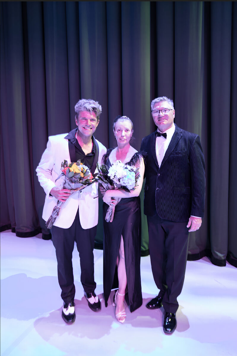 Brevard Ballet Academy cast members with flowers on stage after a production