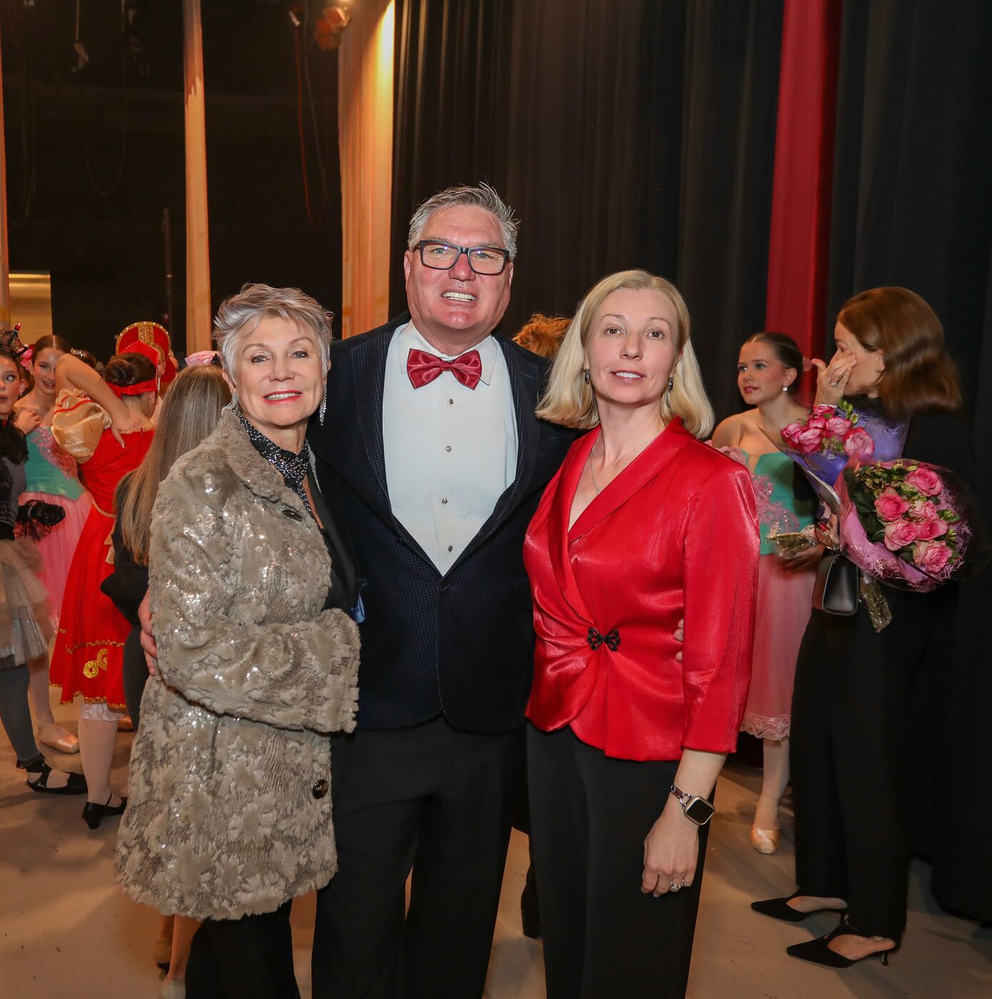 Brevard Ballet Academy directors backstage with dancers after a Nutcracker performance