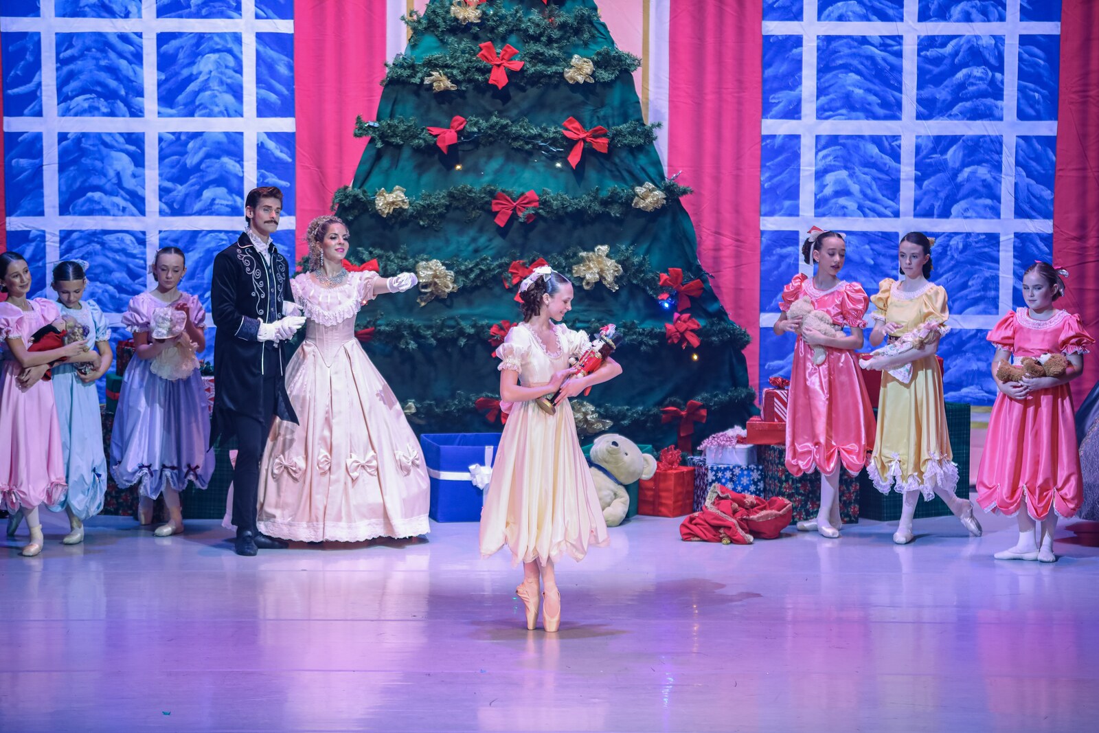 Clara with her Nutcracker doll in the party scene of The Nutcracker by the Brevard Ballet Youth Company in Melbourne FL