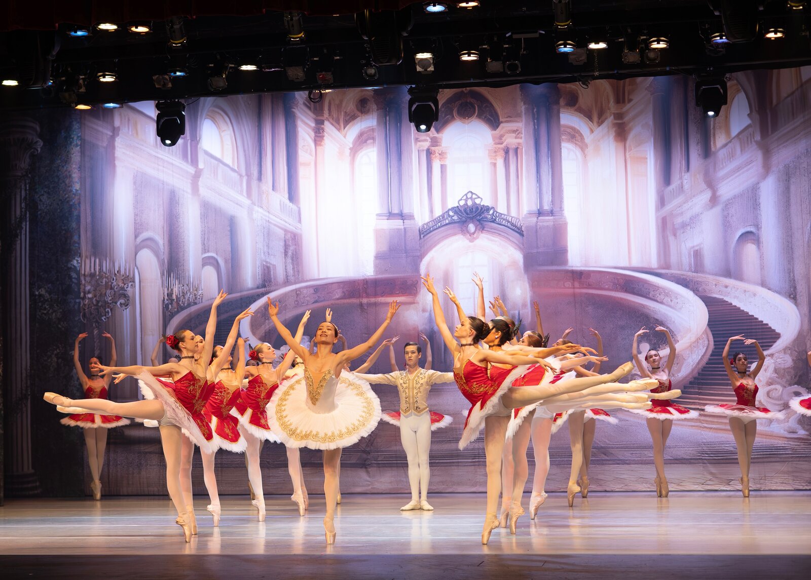 Brevard Ballet Youth Company dancers in arabesque with a palace backdrop in Melbourne FL